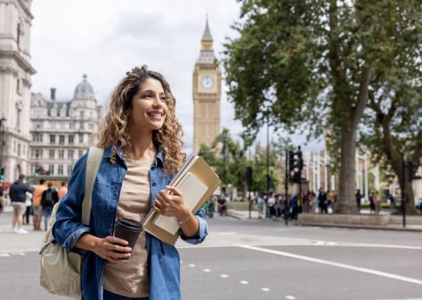 Student walking near Big Ben in London, representing starting a UK university degree
